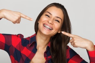 woman smiling with braces